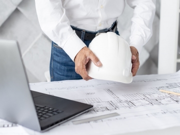 architect arranging his desk with tools